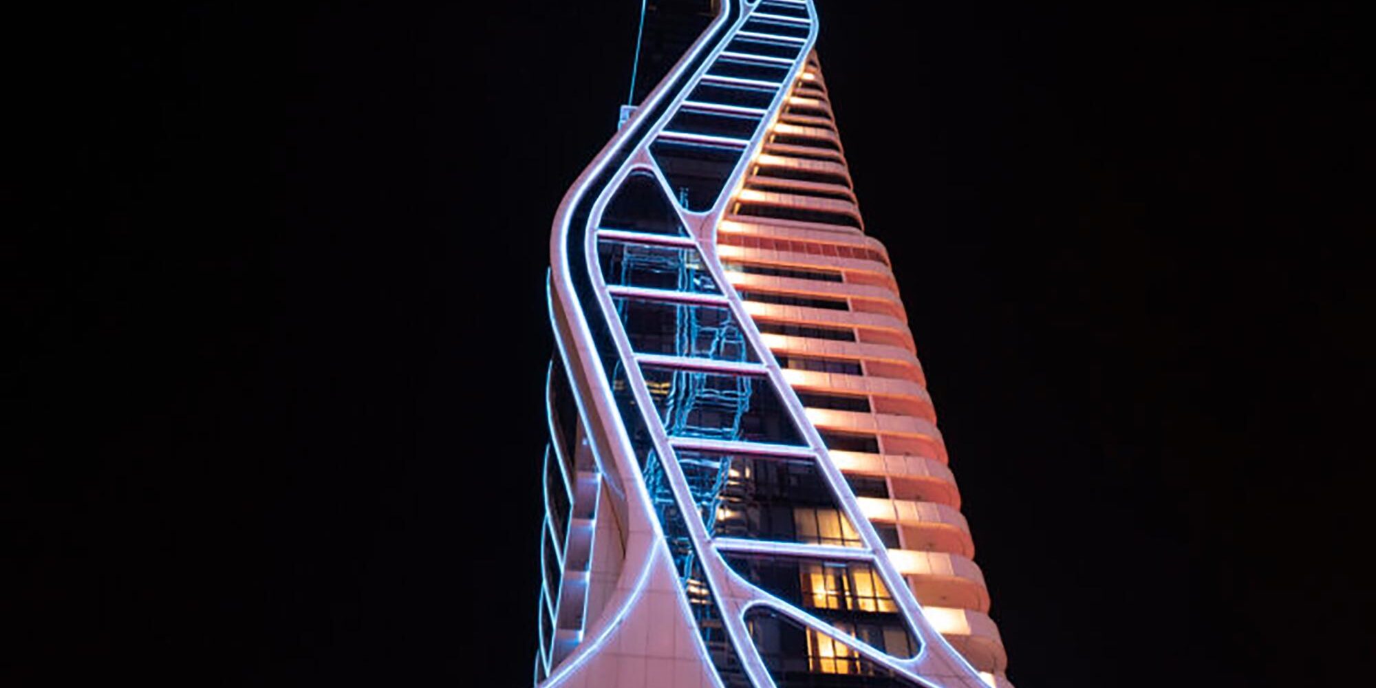 RGBW lighting illuminates the side of a building