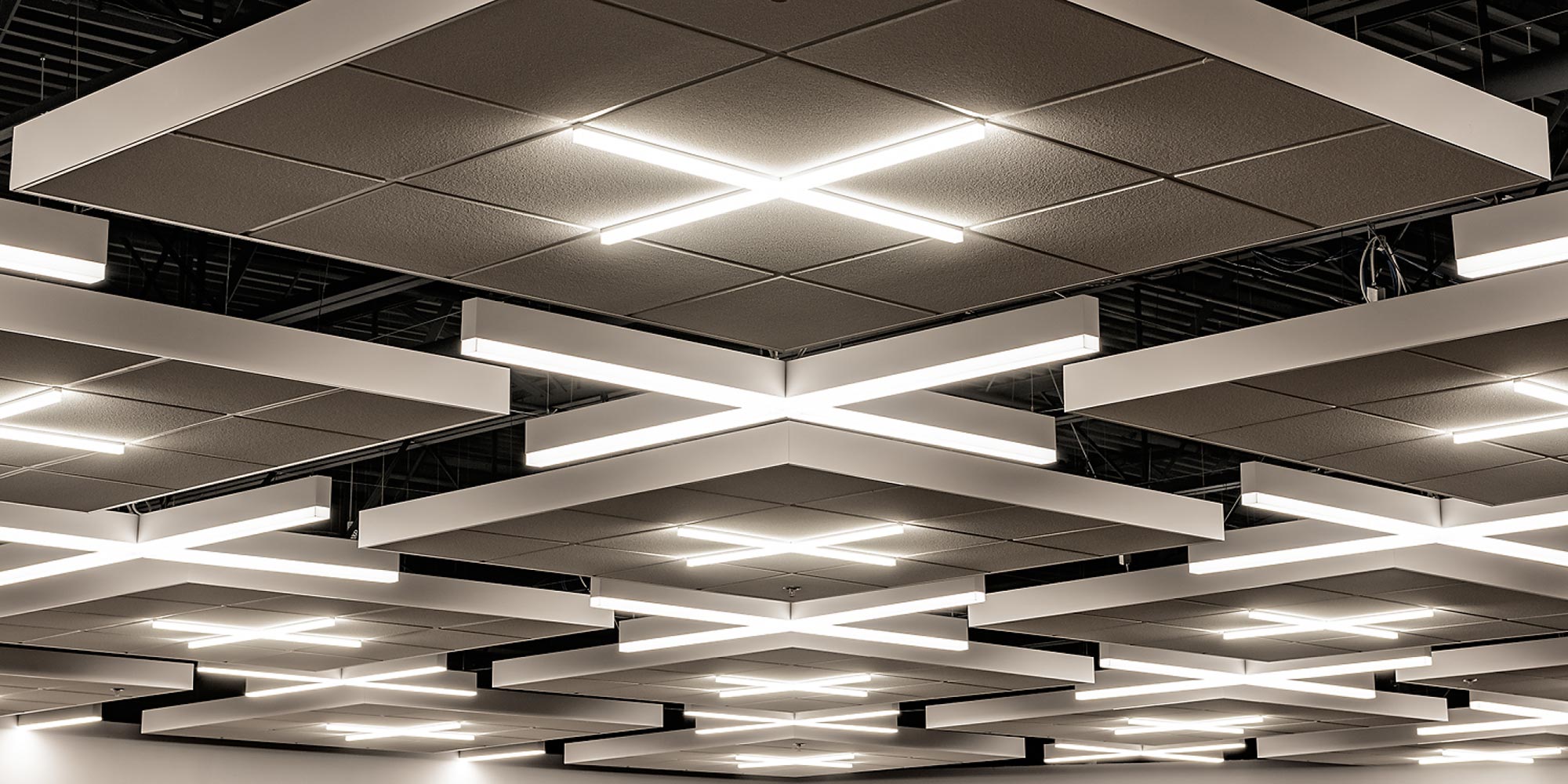 X-Shaped lighting in both suspended and T-Bar Grid installations