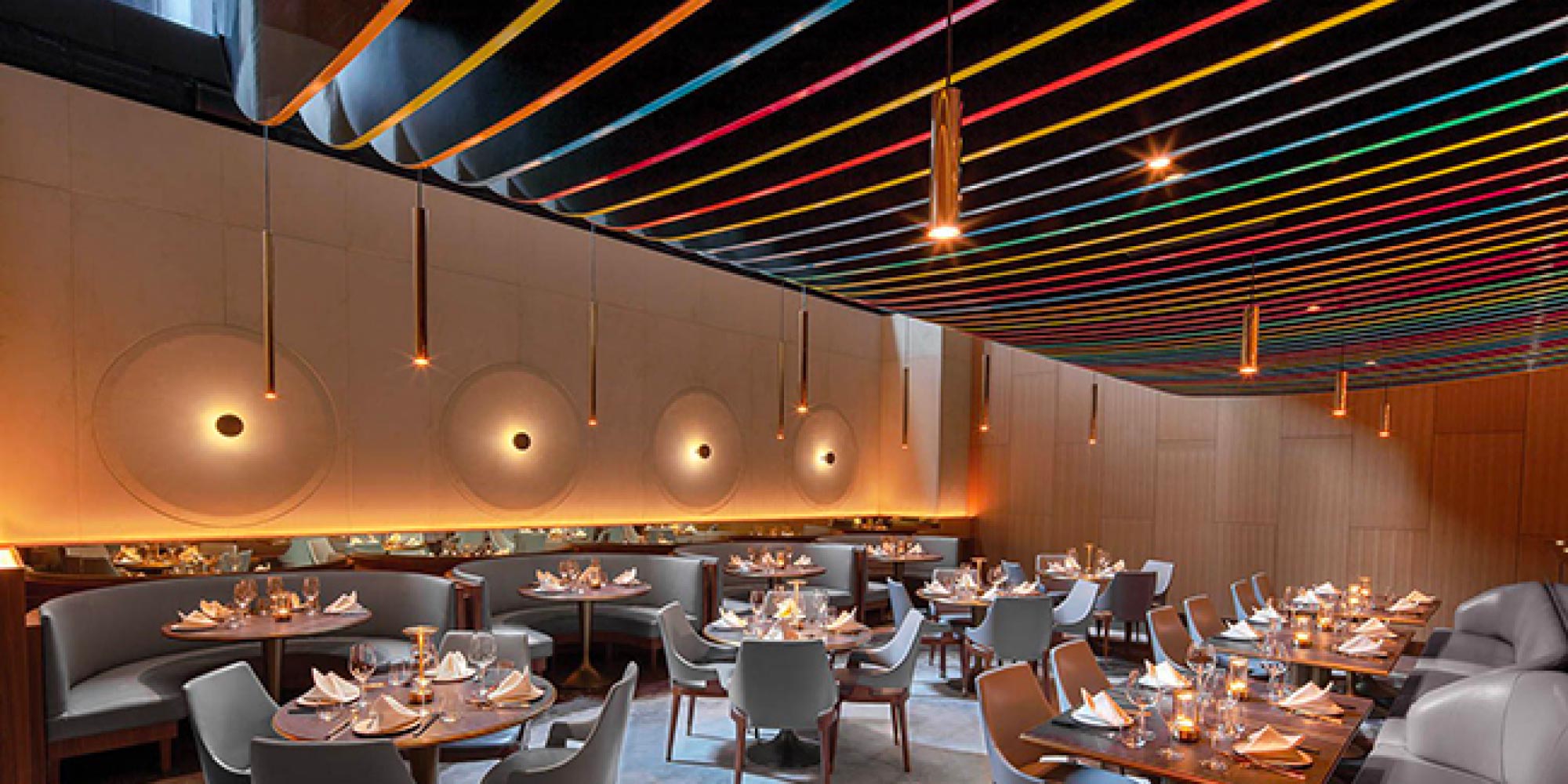 Cylindrical pendant LED lighting in an upscale restaurant